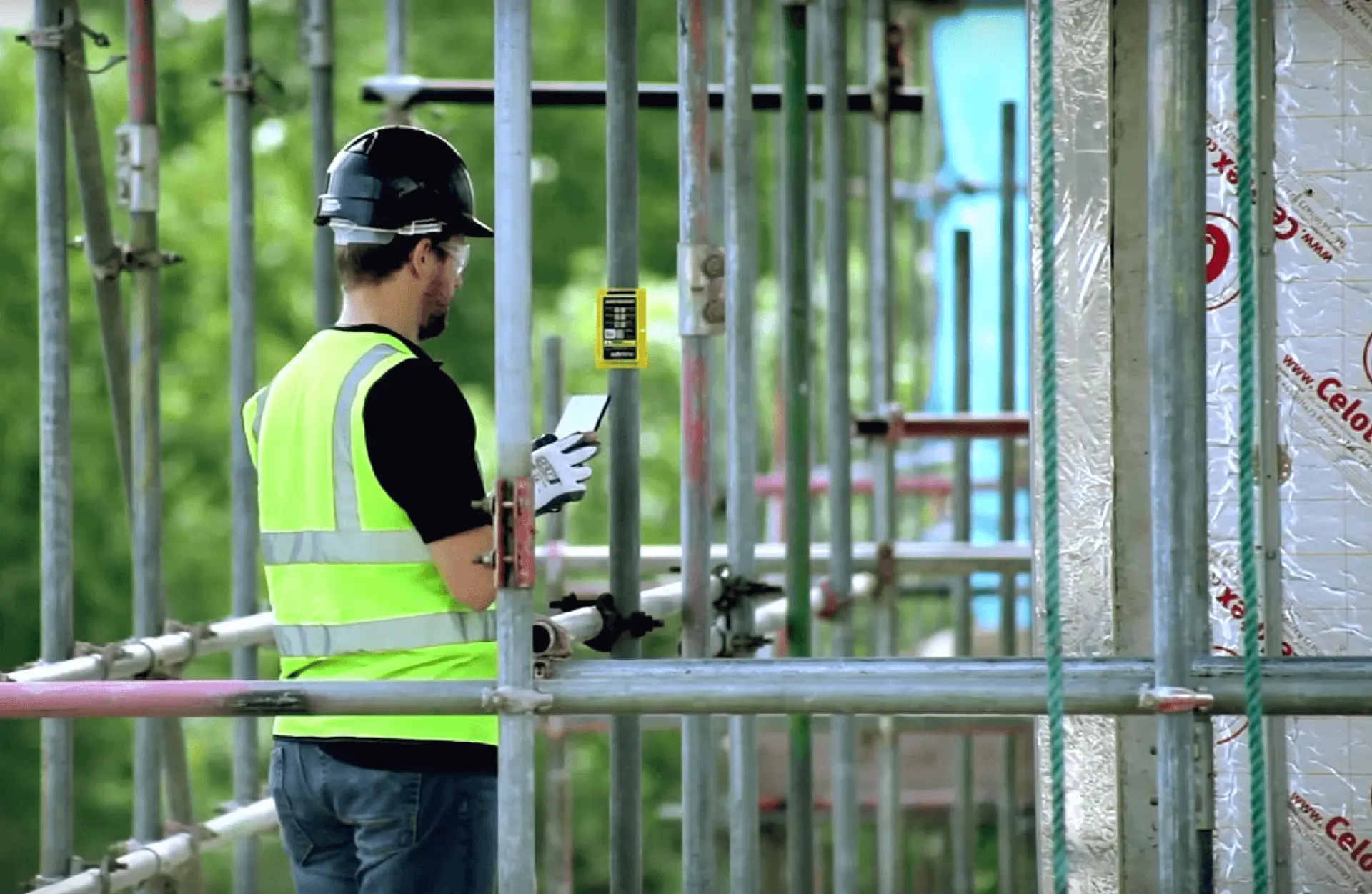 Construction worker conducting a digital inspection